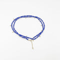Beads necklace featuring 18 karat gold plated ornaments that can be styled as a bracelet or belt. - ELLY