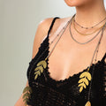 Handmade necklace, featuring a black rhodium coated metal chain with yellow gold finishes - ELLY