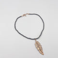 Rhodium coated brass pendant on a metallic string - ELLY