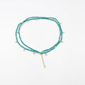 Beads necklace featuring 18 karat gold plated ornaments that can be styled as a bracelet or belt. - ELLY
