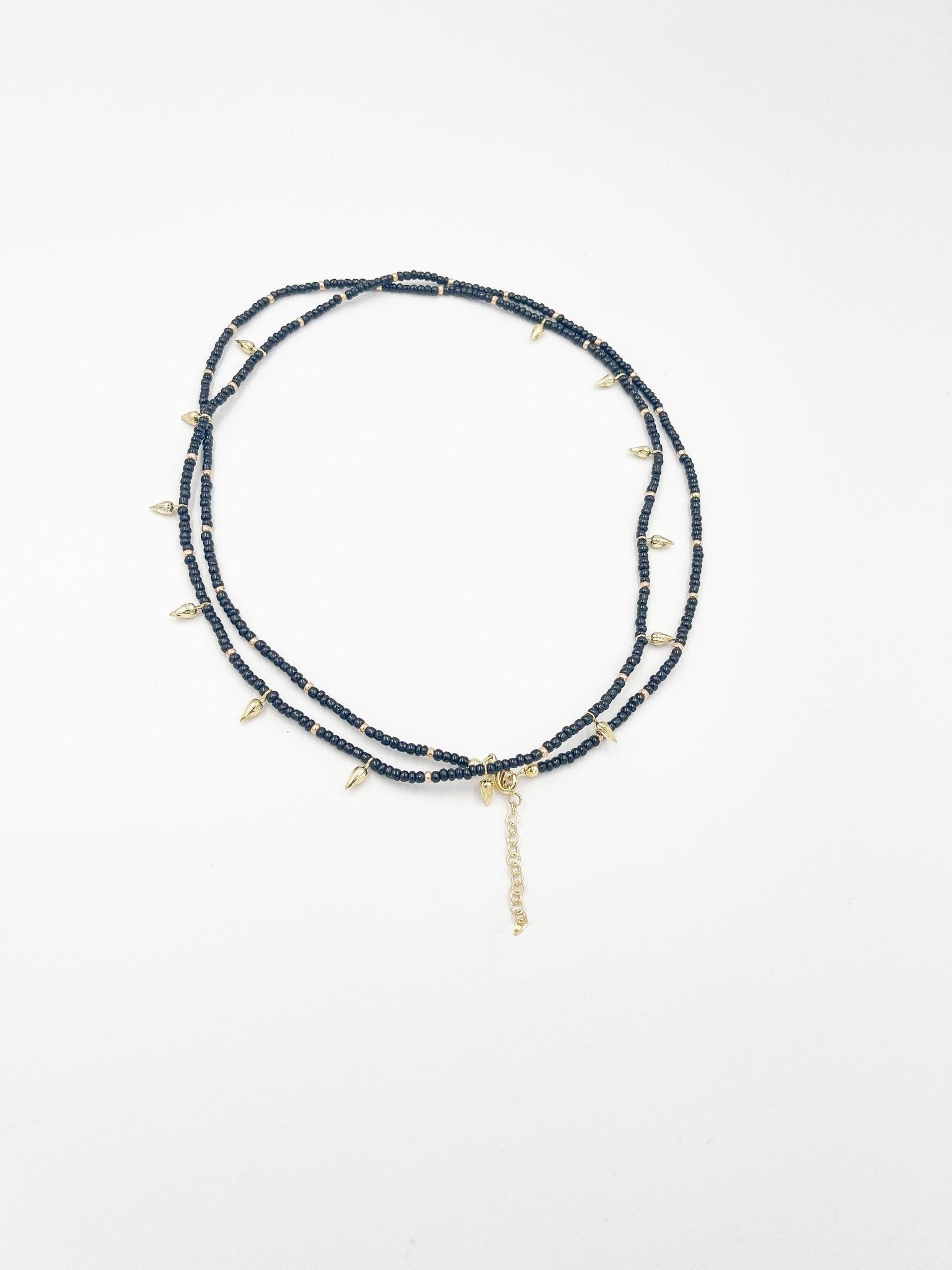 Beads necklace featuring 18 karat gold plated ornaments that can be styled as a bracelet or belt. - ELLY