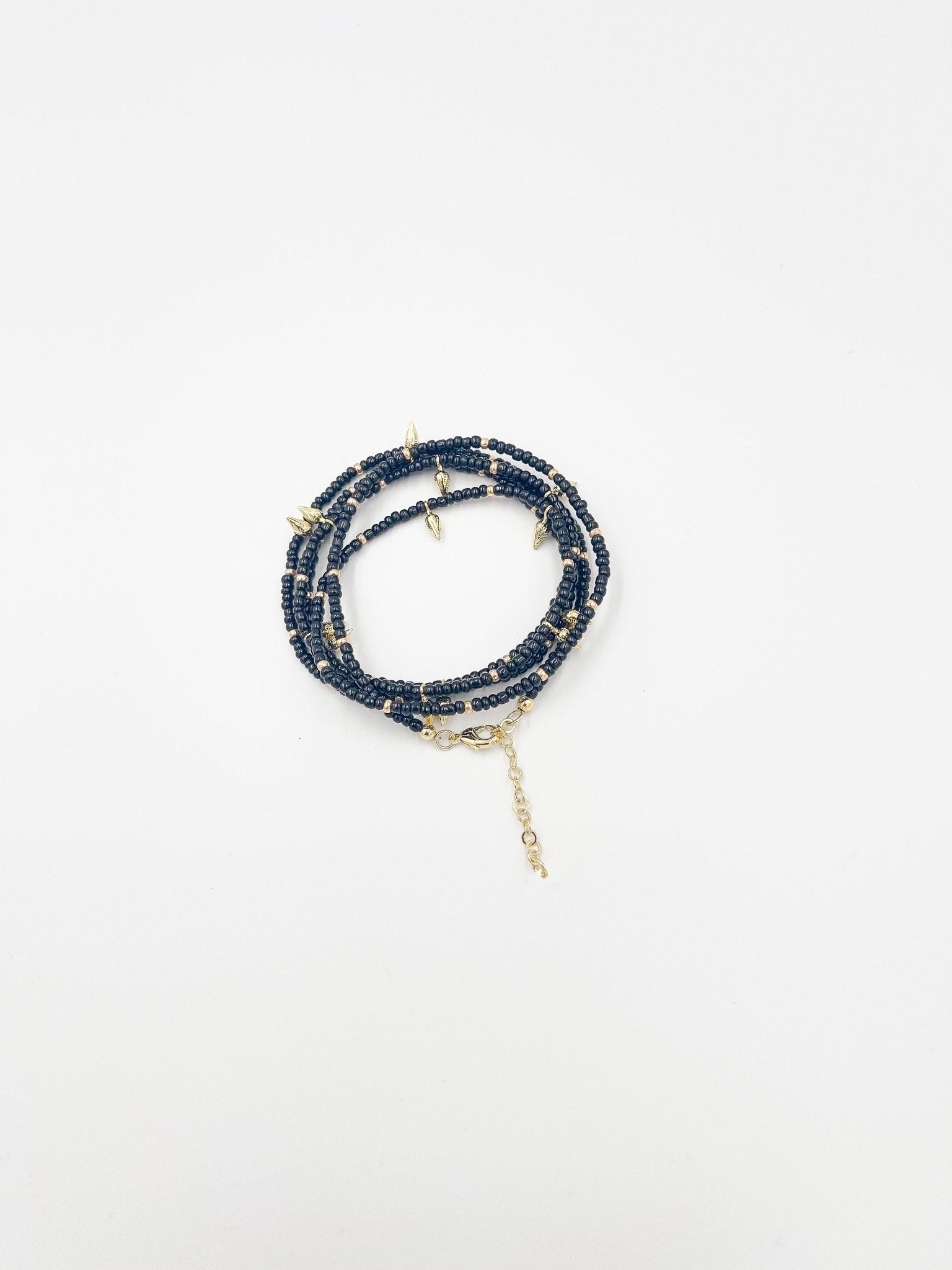 Beads necklace featuring 18 karat gold plated ornaments that can be styled as a bracelet or belt. - ELLY